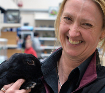 Pets Team Leader Trish poses with Rabbit
